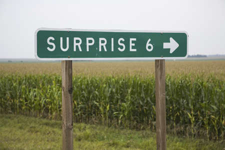 Road sign pointing to Surprise, Nebraskaのeditorial素材