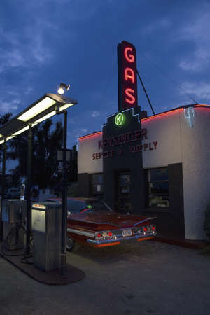 Neon sign reading Gas and 1960 red Impala Chevrolet at Kensinger Service & Supply historic gas...