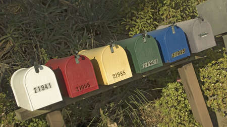 Rainbow colored mail boxes lined up in Malibu, Californiaのeditorial素材