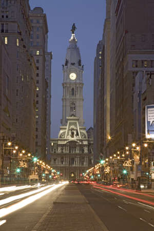 William Penn statue on the top of City Hall at dusk and streaked car lights from Broad Street, Philadelphia, Pennsylvania, the City of Brotherly Loveのeditorial素材