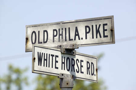 Old street sign in Lancaster County Old Phila Pike and White Horse Road, Pennsylvaniaのeditorial素材