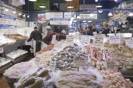 Pike Place Fish Market, in downtown Seattle, Washington displaying fresh fish for sale in interior view of the fish marketのeditorial素材