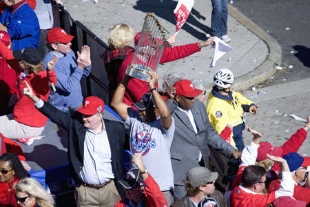 Bus with Philadelphia Phillies and Mayor Michael Nutter hoisting World Series trophy over his head,...