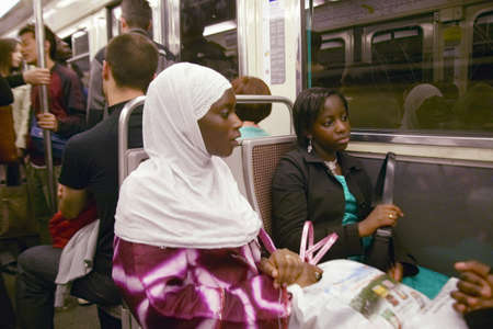 Muslim Woman riding the Metro Train, Paris, Franceのeditorial素材
