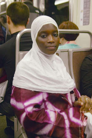 Muslim Woman riding the Metro Train, Paris, Franceのeditorial素材