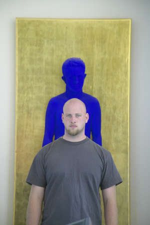 Painter stands in front of sculpture of Yves Klein, the Museum of Modern and Contemporary Art of...
