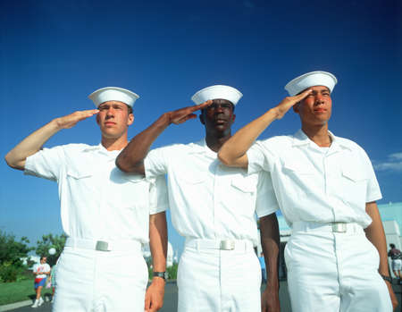 Ethnically diverse trio of sailors saluting