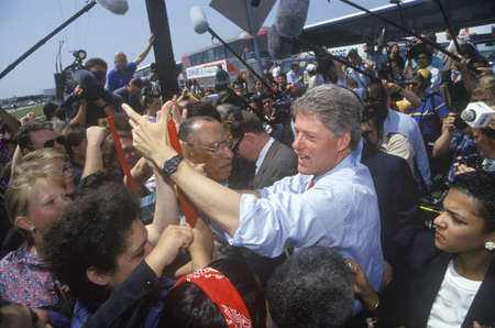 Governor Bill Clinton shakes hands at an unscheduled bus stop on the Clinton/Gore 1992 Buscapade campaign tour in Texasのeditorial素材