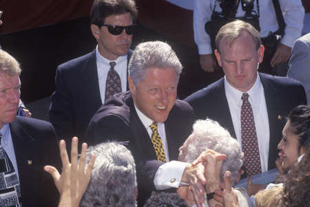 Former President Bill Clinton greets the crowd at a Santa Barbara City College campaign rally in 1996, Santa Barbara, Californiaのeditorial素材