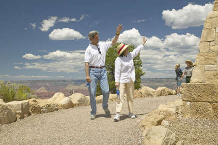 Senator and Mrs. John Kerry walking down path and waving at rim of Bright Angel Lookout, Grand Canyon, AZのeditorial素材
