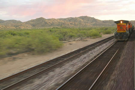 Whistle Stop Kerry Express across America train moving through landscape, American Southwestのeditorial素材
