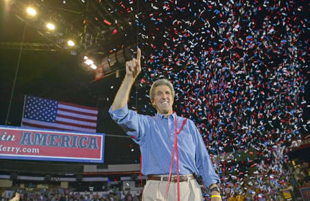 Confetti falls on an exuberant Senator John Kerry at a rally at the Thomas Mack Center at UNLV, Las Vegas, NVのeditorial素材