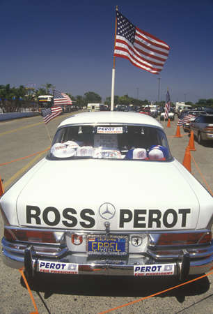A Mercedes-Benz automobile emblazoned with lettering and bumper stickers supporting Ross Perot for...
