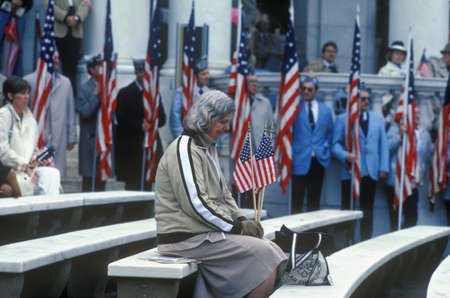 Seated Woman Holding American Flags, Washington, D.C.のeditorial素材