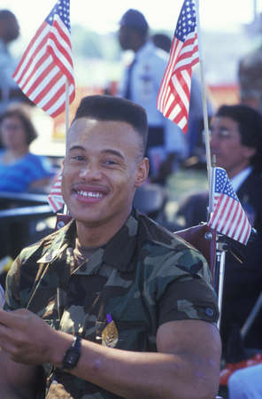 African-American Soldier in Wheelchair with American Flags, Washington, D.C.のeditorial素材