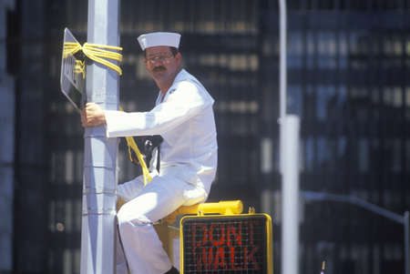 Sailor Sitting on Traffic Sign, New York City, New Yorkのeditorial素材
