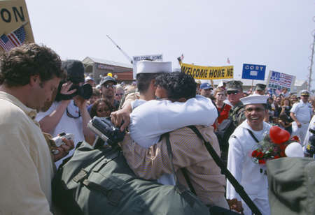 American Sailor Hugging Family Member After Returning Home From Seaのeditorial素材