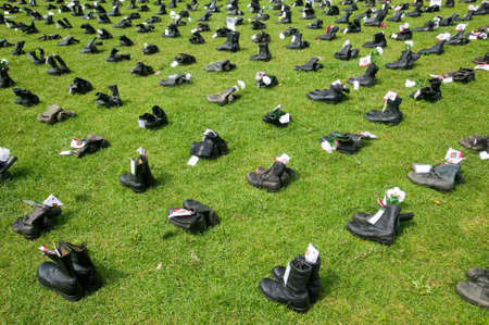 1746 Military boots symbolizing US Military Personnel killed in Iraq as displayed at Independence Hall ÒEyes Wide OpenÓ exhibit, Philadelphia, Pennsylvania on July 4, 2005のeditorial素材