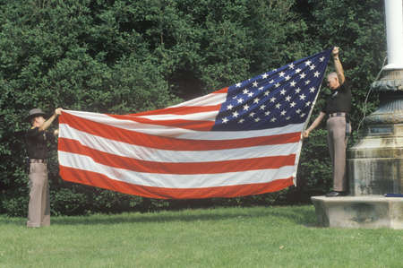 Two Officers Folding the American Flag, Charlottesville, Virginiaのeditorial素材
