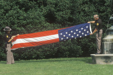 Two Officers Folding the American Flag, Charlottesville, Virginiaのeditorial素材