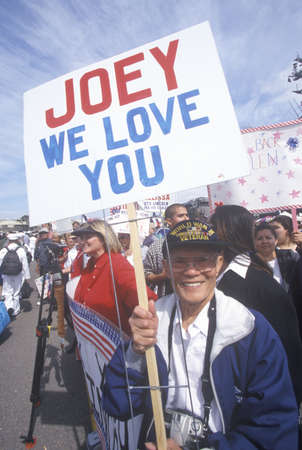 Family and friends at a sailor's homecomingのeditorial素材