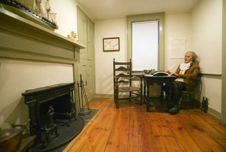 Reenactment with prop of Thomas Paine at work in his home in New Rochelle, New York