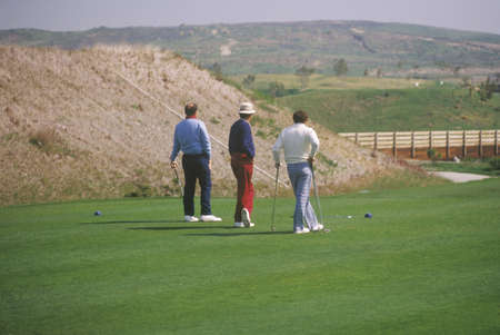 Three golfers walking on green, Laguna Niguel, CAのeditorial素材