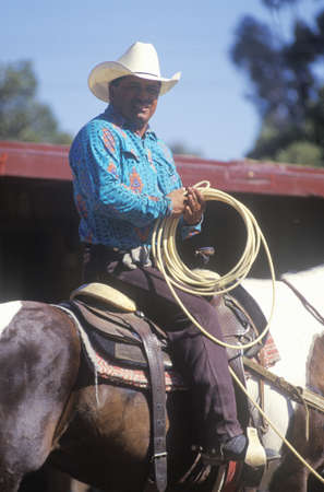 Portrait of cowboy on horseback with lasso, Santa Barbara Old Spanish Days, Earl Warren Fairgroundのeditorial素材