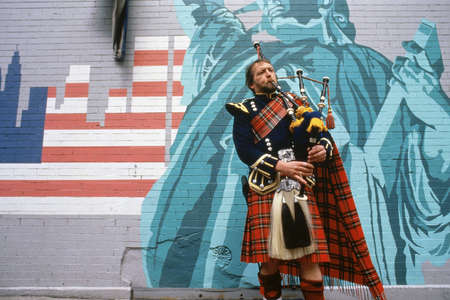 Man playing bagpipes at St. Patrick's Day parade, New York cityのeditorial素材