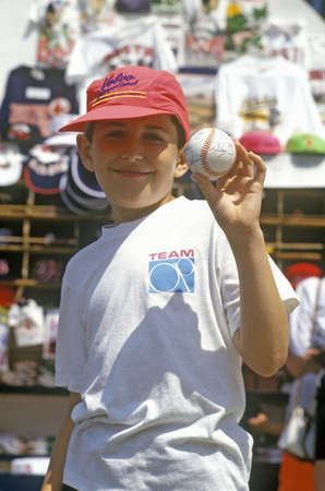 Boy Holding Autographed Baseball, Fenway Park, Boston, Massachusettsのeditorial素材