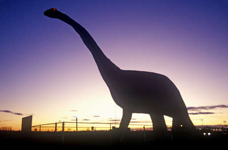 Silhouette of statue of Brontosaurus, SD at sunsetのeditorial素材