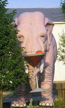 Statue of large pink elephant with martini in IDのeditorial素材