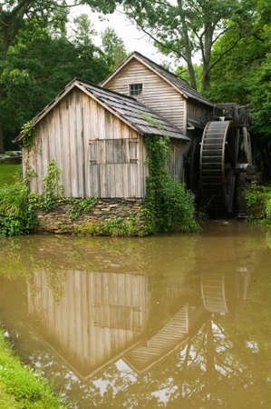 Historic Edwin B. Mabry Grist Mill (Mabry Mill) in rural Virginia on Blue Ridge Parkway and reflection on pond in summerのeditorial素材