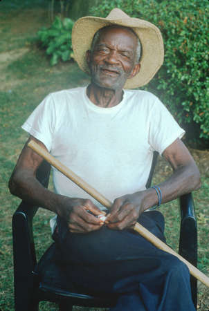 An 86-year old African-American man sitting in a chair, Rockville, MDのeditorial素材