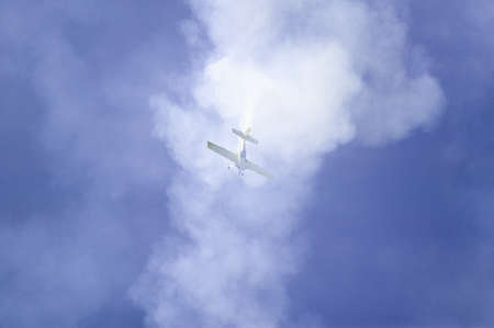 Stunt pilot Rob Harrison flying the Zlin, a bright yellow aircraft called the Tumbling Bear at the 42nd Naval Base Ventura County (NBVC) Air Show at Point Mugu, Ventura County, Southern California.のeditorial素材