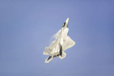 US Air Force F-22A Raptor Jet Fighter making extreme turn at the 42nd Naval Base Ventura County (NBVC) Air Show at Point Mugu, Ventura County, Southern California.のeditorial素材