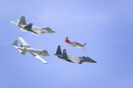 United States Air Force on its 50th anniversary featuring heritage flight with four vintage planes, the P-51 Mustang, F-22 Raptor, A-10A Thunderbolt II, and F-15E Strike Eagle at the 42nd Naval Base Ventura County (NBVC) Air Show at Point Mugu, Ventura Coのeditorial素材