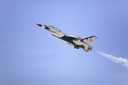 US Air Force F-16C Fighting Falcons, known as the Thunderbirds, flying in blue sky over the 42nd...