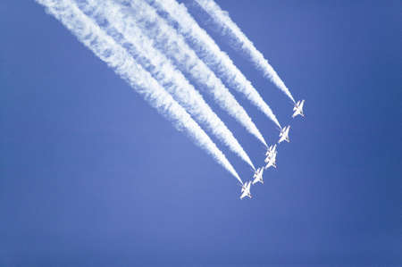 Six US Air Force F-16C Fighting Falcons, known as the Thunderbirds, flying in formation with white trailer of smoke over the 42nd Naval Base Ventura County (NBVC) Air Show at Point Mugu, Ventura County, Southern California.のeditorial素材