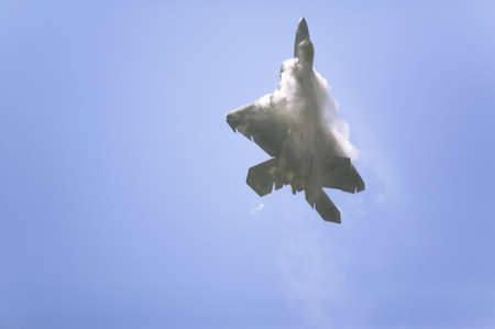 US Air Force F-22A Raptor Jet Fighter making extreme turn at the 42nd Naval Base Ventura County (NBVC) Air Show at Point Mugu, Ventura County, Southern California.のeditorial素材
