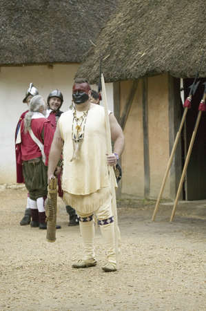 Native American reenactor at James Fort, Jamestown Settlement, on the 400th Anniversary of...