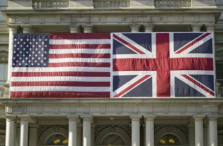 American Flag mounted flat next to Union Jack British Flag on the ,Dwight D. Eisenhower Executive Office Building, next to the White House, Washington, DC, symbolizing the Special Relationship between England and America, the two countries that share the のeditorial素材