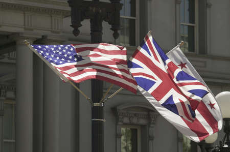 American Flag hanging with Union Jack British Flag next to the White House, Washington, DC, symbolizing the Special Relationship between England and America, the two countries that share the oldest international relationshipのeditorial素材