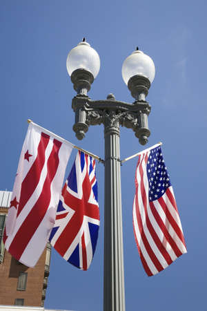 American Flag hanging with Union Jack British Flag next to the White House, Washington, DC, symbolizing the Special Relationship between England and America, the two countries that share the oldest international relationshipのeditorial素材