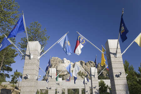 Fifty State flags lining the walkway to Grand Terrace view of Mount Rushmore National Memorial, South Dakotaのeditorial素材