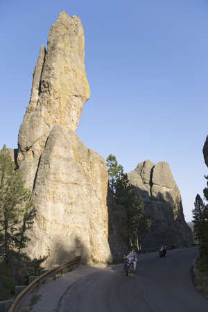Motorcyclist driving Needles Highway, Black Hills, near Mount Rushmore National Memorial, South Dakotaのeditorial素材