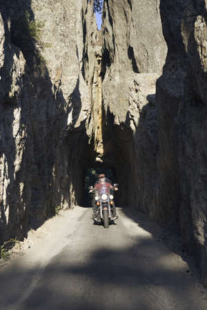 Motorcyclist driving Needles Highway, Black Hills, near Mount Rushmore National Memorial, South Dakotaのeditorial素材