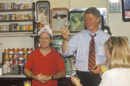Governor Bill Clinton and wife Hillary meet the town's people at Dee's Restaurant on the 1992 Buscapade campaign tour in Corsicana, Texasのeditorial素材