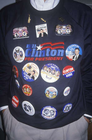 Man shows off Clinton/Gore buttons on sweater after victory announcement in Little Rock Arkansas, 1992のeditorial素材