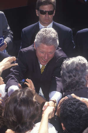 Former President Bill Clinton meets the crowd at a Santa Barbara City College campaign rally in 1996, Santa Barbara, Californiaのeditorial素材